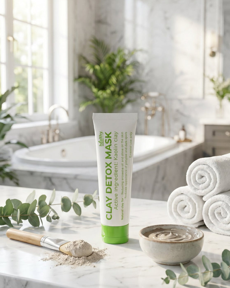 Healthy Detox Clay Mask with kaolin clay, brush and bowl on a marble counter (illustrative image)